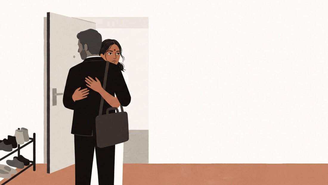 A woman embraces her husband at the front door as he comes home, her eyes open and alert over his shoulder.