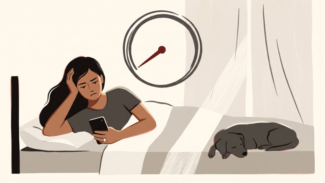 A woman who plainly slept well frowns at her phone in bed, a dial above her pointing low, the dog still asleep at her feet.