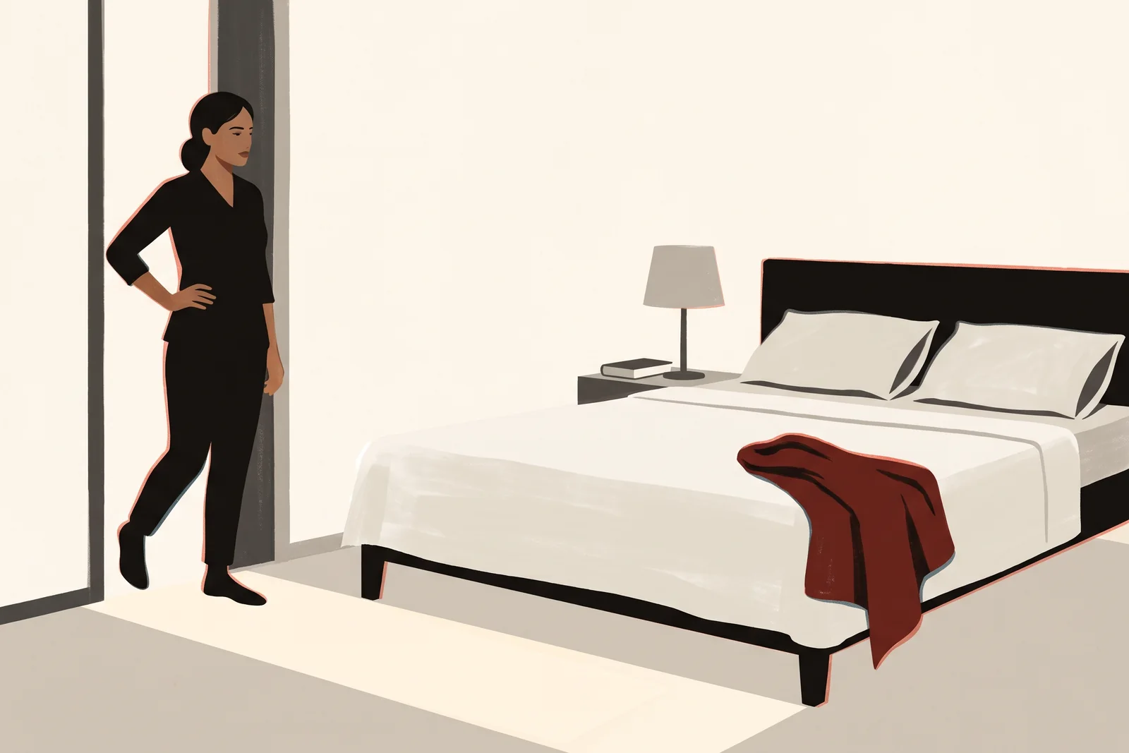 A neatly made double bed with a damp red towel dumped on one side, and a woman stopped in the doorway looking at it.