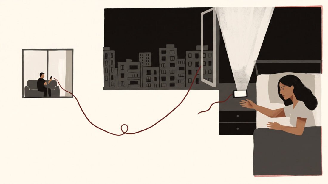 A woman in bed reaches for a phone that has just lit up, a red cord running from it across the night city to a man on a sofa.