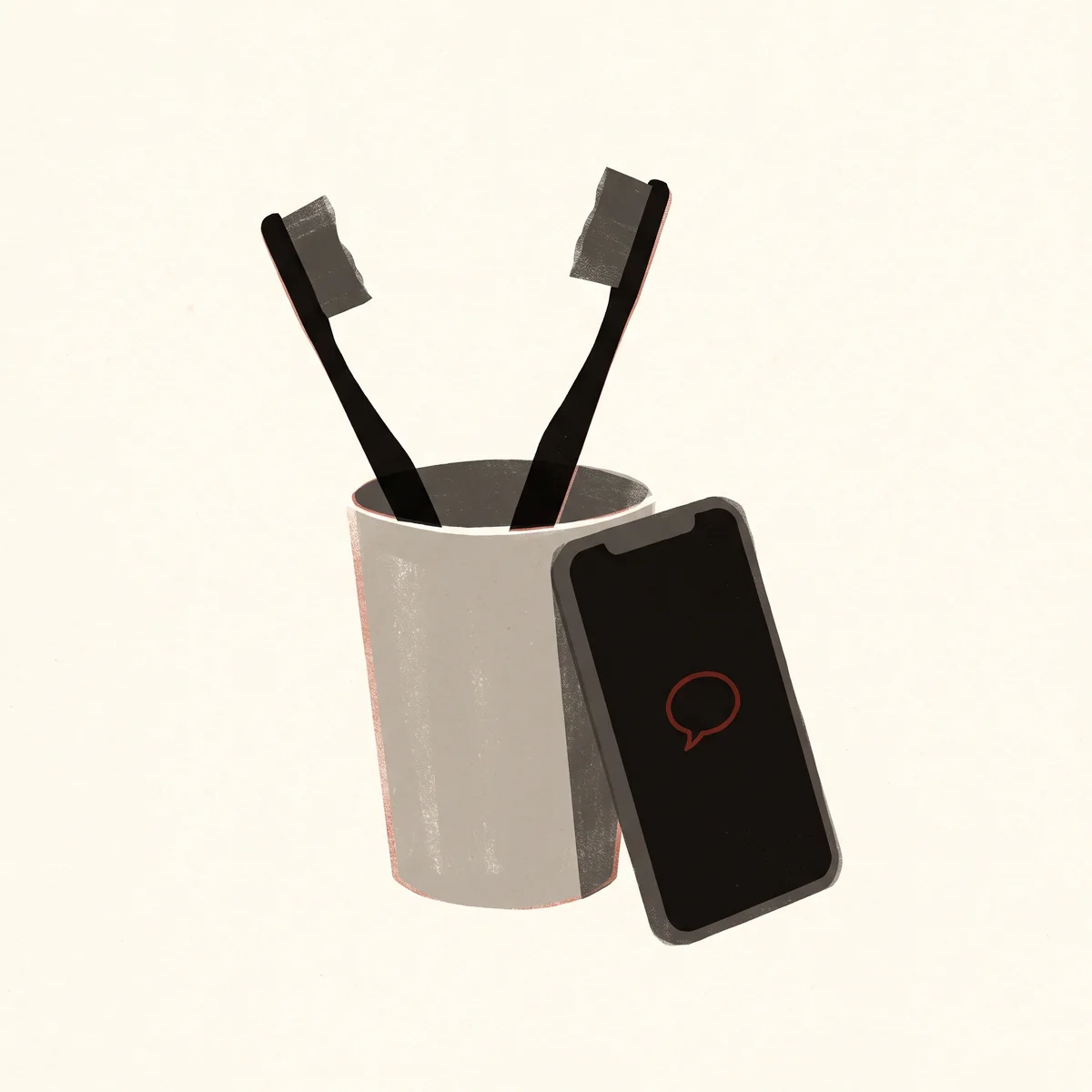 Two toothbrushes lean apart in a tumbler, and propped against it a phone shows a small red speech bubble.